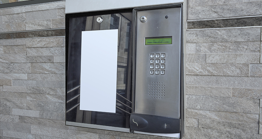 telephone entry system mounted to an exterior wall 