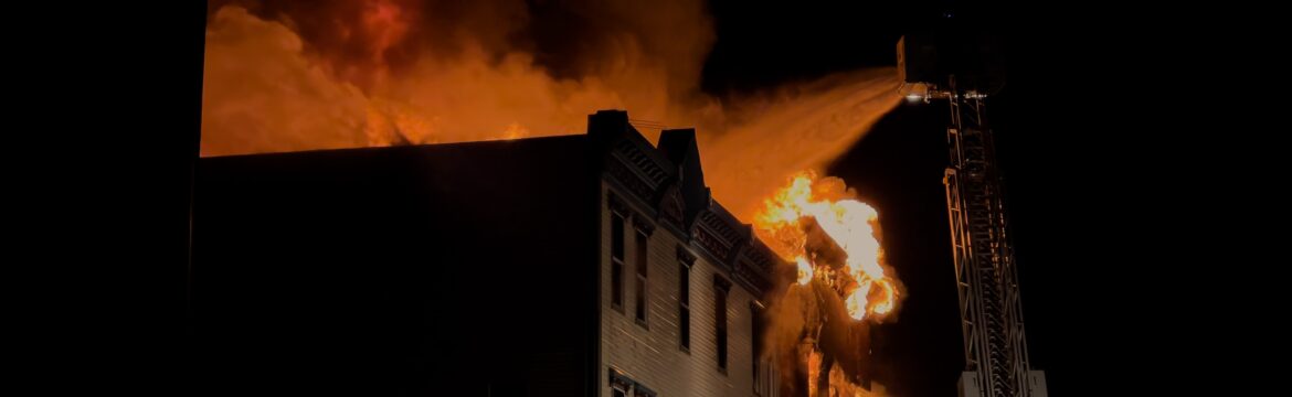 photo of a building on fire for a blog post about fire protection