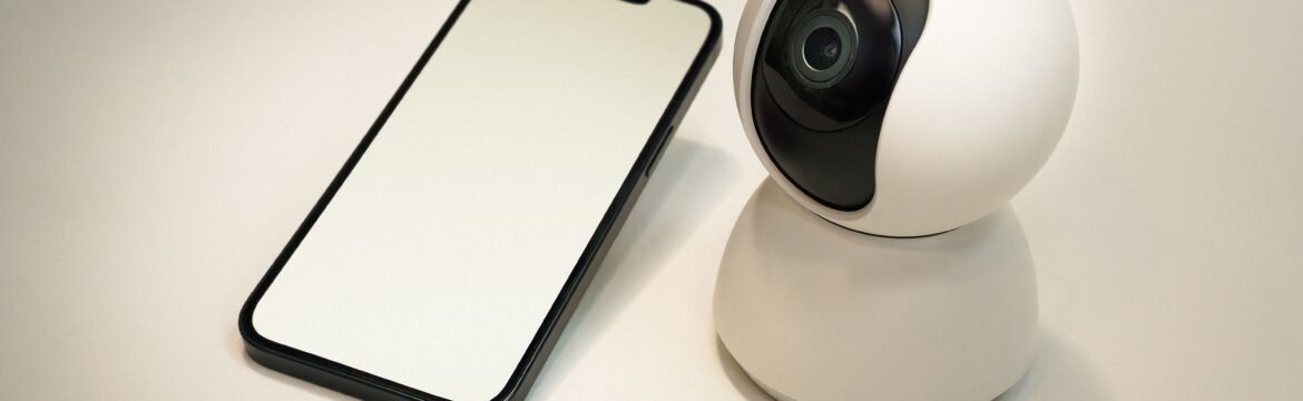 security camera next to phone security monitoring system